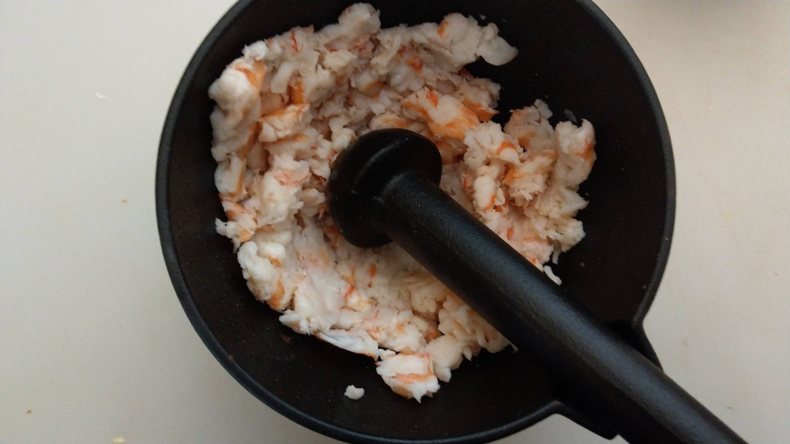 Mortaring the chopped shrimp