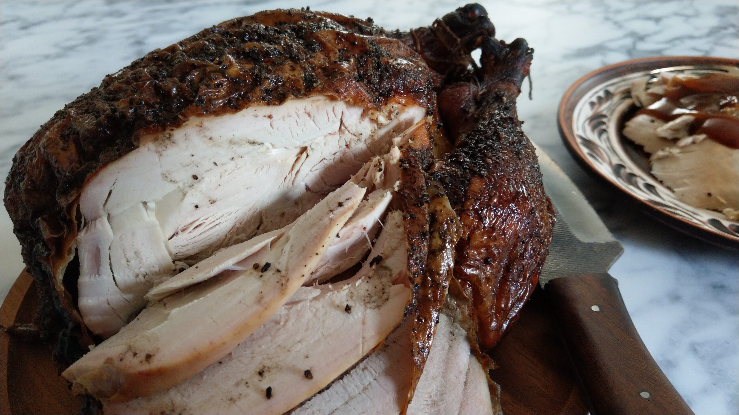 The roast chicken, partially carved