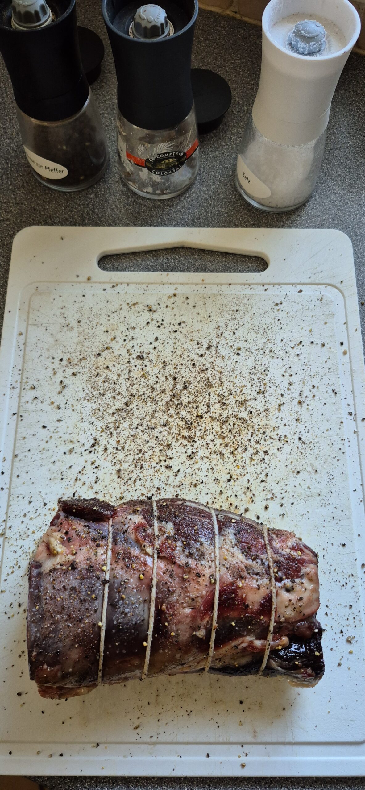 Rolled Dexter filet, about to be oiled and rolled on salt, pepper and allspice
